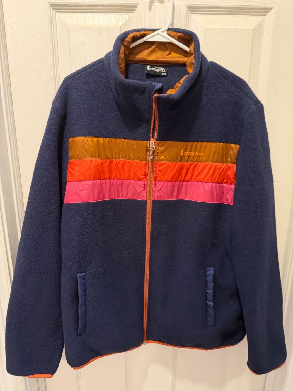 Cotopaxi Women’s Teca Navy Fleece Jacket with Orange & Pink Stripe Accents